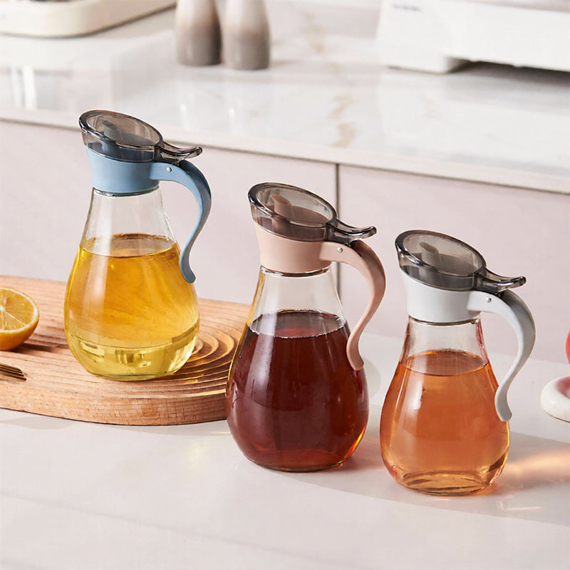Lavish Kitchen Isle 380ml glass sauce dispenser with plastic top for oil, syrup, and condiments on a kitchen counter.
