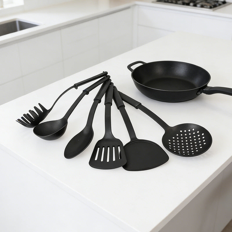 Set of six black heat-resistant plastic cooking utensils from Lavish Kitchen Isle, including spatulas and spoons for versatile kitchen use.