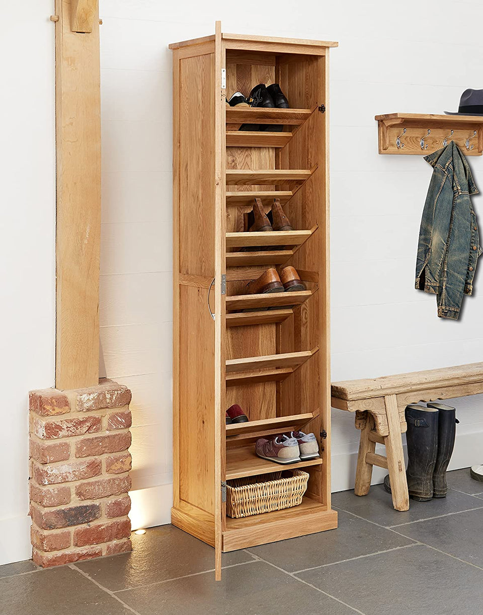 Baumhaus Mobel Oak tall shoe cupboard with multiple storage compartments and sleek wooden finish.