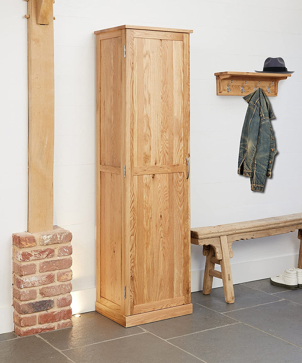 Baumhaus Mobel Oak tall shoe cupboard with multiple storage compartments and sleek wooden finish.