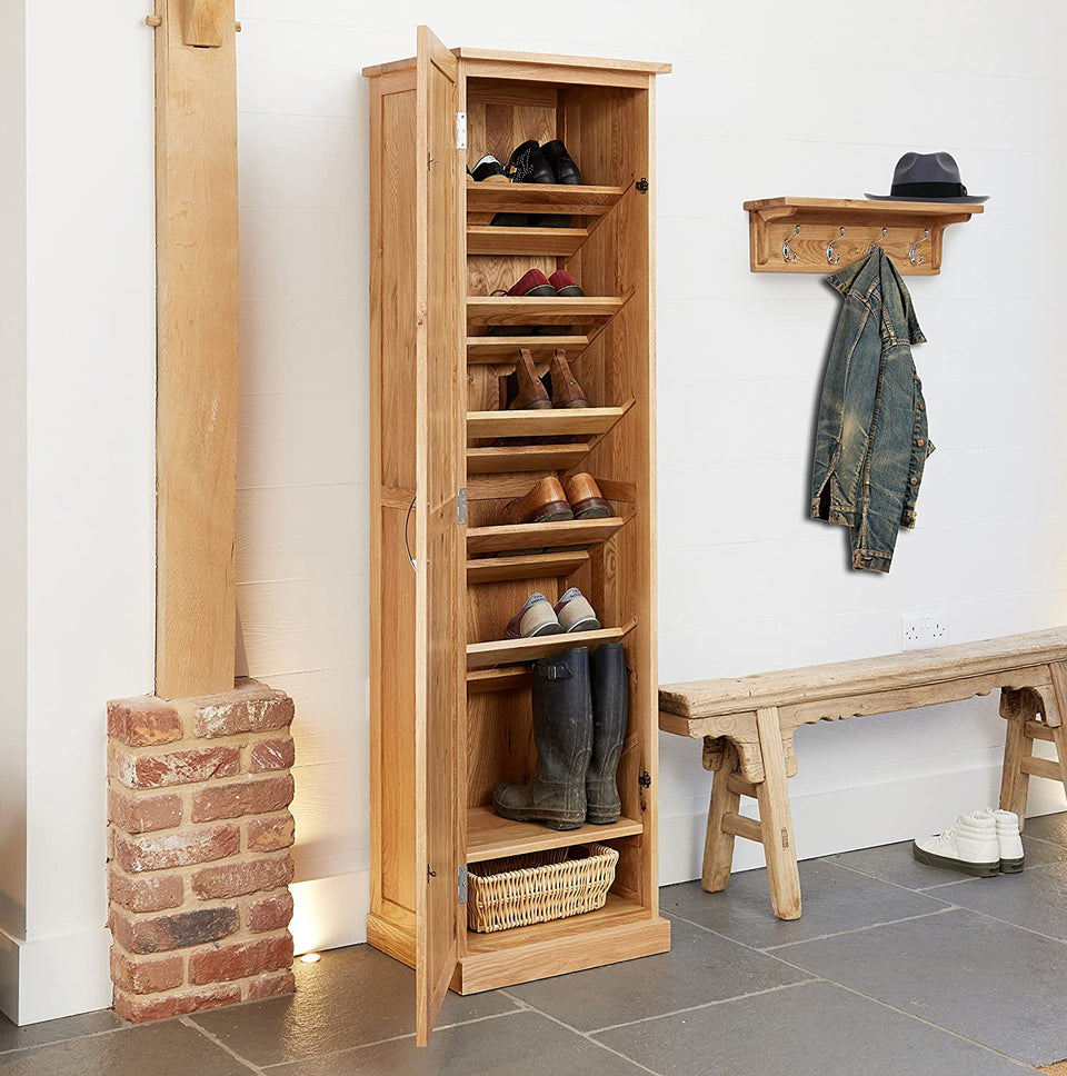 Baumhaus Mobel Oak tall shoe cupboard with multiple storage compartments, crafted from oak for durable, stylish organization.