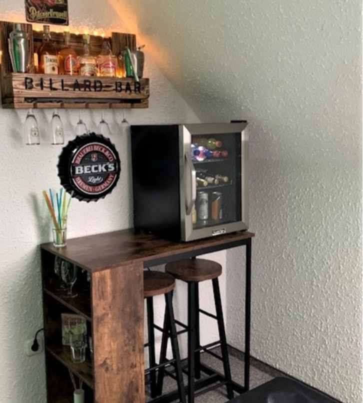 Industrial style HOMCOM bar table set featuring a table and two stools with a storage shelf for added convenience.