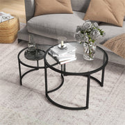 Modern nesting coffee tables set by Lavish Kitchen Isle with tempered glass tops and steel frames, shown in a contemporary living room.