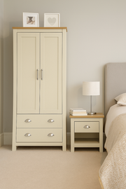 Lavish Kitchen Isle Ite 2-piece bedroom set with cream and oak finish, includes a 2-door wardrobe and a bedside table with drawer.
