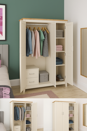 Lavish Kitchen Isle cream and oak effect 3-door wardrobe with hanging rail, shelves, and storage drawers in a modern bedroom setting.