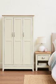 Lavish Kitchen Isle 2-piece bedroom set with a 3-door wardrobe, shelving, and a bedside table featuring a drawer and storage.