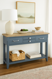 Baumhaus Signature Blue console table featuring a sleek design and elegant finish in a stylish living room setting.