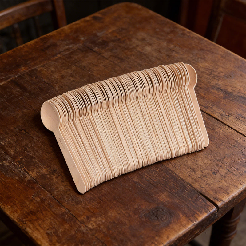 Set of 100 eco-friendly disposable wooden spoons from Lavish Kitchen Isle, natural, recyclable, 15.5cm long.