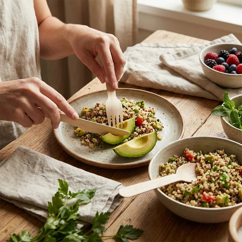 Set of 100 disposable wooden cutlery pieces including spoons, forks, and knives, 15.5cm, from Lavish Kitchen Isle.