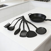 Set of six black heat-resistant plastic cooking utensils from Lavish Kitchen Isle, including spatulas and spoons for versatile kitchen use.