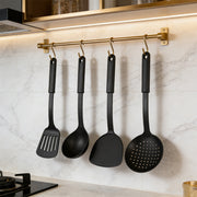 Set of six black heat-resistant plastic cooking utensils from Lavish Kitchen Isle, including spatulas and spoons for versatile kitchen use.
