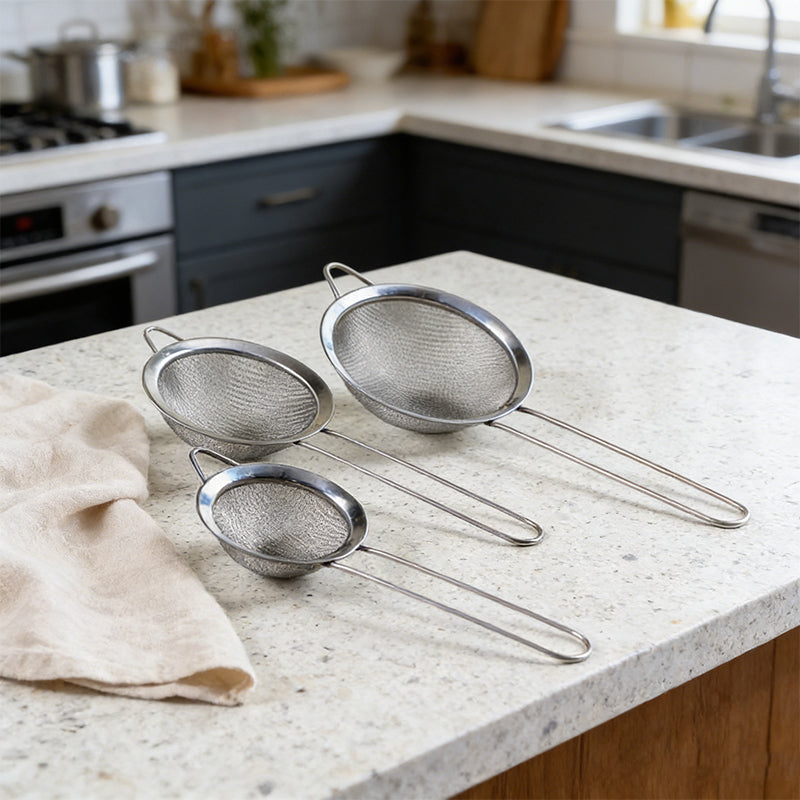 Set of three stainless steel kitchen strainers with fine mesh from Lavish Kitchen Isle, ideal for sifting and draining in cooking.