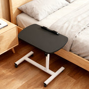 Black adjustable overbed table with wheels for home or medical use, featuring a sleek design and sturdy construction.