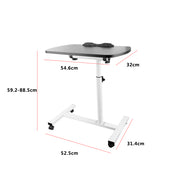 Black adjustable overbed table with wheels, designed for home or medical use, featuring a sturdy surface and easy mobility.