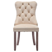 Set of 4 grey and beige velvet wingback dining chairs with button tufted backrests and solid wood legs by Lavish Kitchen Isle