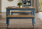 Baumhaus Signature Blue Dining Table with sleek wooden surface and modern design, suitable for contemporary dining spaces.