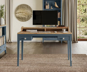 Baumhaus signature blue desk with sleek design, featuring a spacious tabletop and elegant legs, ideal for dressing or working.