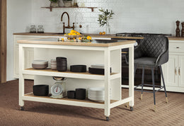 Cream kitchen island with open shelves and breakfast bar by Baumhaus, featuring a modern design and ample storage space.