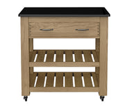 Baumhaus oak kitchen island with two drawers, black granite top, and brake wheels for easy mobility.