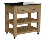 Baumhaus oak kitchen island with black granite top, two drawers, and brake wheels, showcasing a functional design.