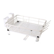 Stainless steel dish drying rack with drip tray and utensil holder, white kitchen drainer for drying dishes and utensils.
