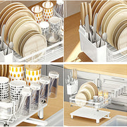 Stainless steel dish drying rack with drip tray and utensil holder, white finish, designed for efficient kitchen dish drying.