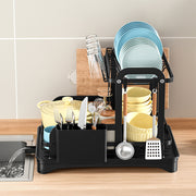 Black 2-tier dish drainer rack with drainage spout, utensil and cutting board holders for kitchen counter drying.