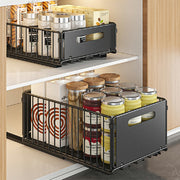 Two black carbon steel storage drawers with smooth sliding mechanisms, ideal for kitchen cabinet organization.