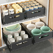 Two black carbon steel storage drawer organizers from Lavish Kitchen Isle with smooth sliding mechanisms.