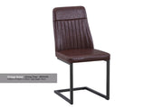 Pair of Baumhaus vintage grey and brown leather dining chairs with wooden legs, shown in a stylish modern dining room setting.