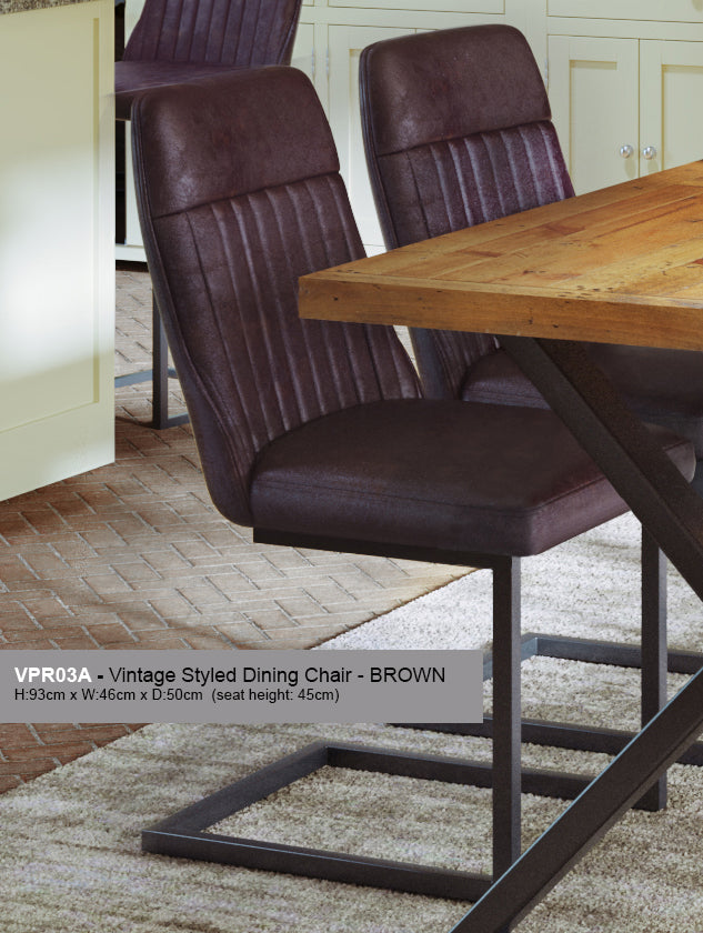 Pair of vintage grey and brown leather dining chairs by Baumhaus, showcasing classic wooden legs and upholstered seats.