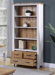 Large white open bookcase with drawers from Baumhaus, showcasing multiple shelves and a sleek design.