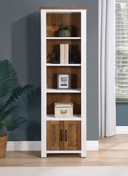 Baumhaus Splash of White narrow bookcase showcasing sleek design and spacious shelves in a bright living room setting.