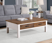 White Baumhaus coffee table featuring four spacious drawers and a sleek design for modern living spaces.