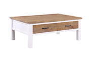 Baumhaus white coffee table featuring four spacious drawers for storage, set in a stylish living room.