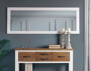 Baumhaus extra long white wall mirror hanging in landscape and portrait orientation, showcasing its sleek design.