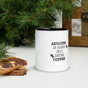 Adulting white ceramic mug with dark interior, stylish design by Lavish Kitchen Isle, perfect for everyday use.