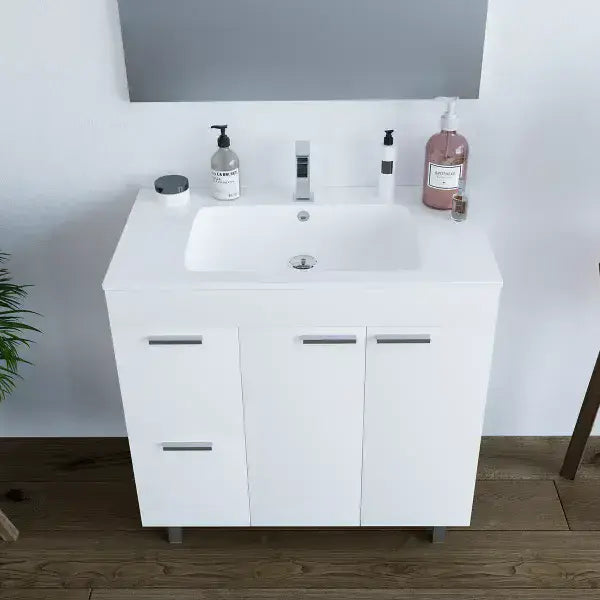 Lavish Kitchen Isle Serenade white gloss bathroom vanity cabinet with two doors, drawers, sink, and mirror for modern bathroom decor.