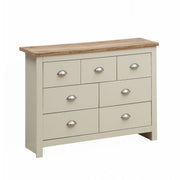 Lavish Kitchen Isle cream bedroom chest of 7 drawers with oak effect top and steel handles, ideal for bedroom storage.
