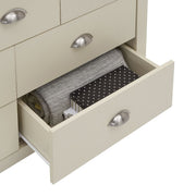 Cream bedroom chest of 7 drawers with oak effect top and steel handles, providing stylish storage from Lavish Kitchen Isle.