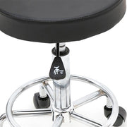 Black round adjustable salon stool with backrest, featuring a sleek design and height adjustment for comfort and support.