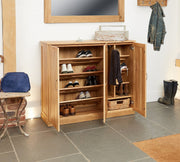 Baumhaus Mobel Oak Extra Large Shoe Cupboard with multiple shelves and a wooden finish, designed for organized storage.