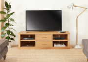 Baumhaus Mobel Oak mounted television cabinet showcasing a sleek design with ample storage for widescreen TVs.