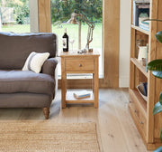 Baumhaus Mobel Oak one drawer lamp table with natural oak finish and minimalist design, showcasing a sleek drawer.