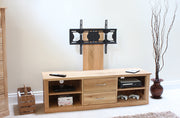 Baumhaus Mobel Oak mounted widescreen television cabinet showcasing sleek design and spacious storage for media devices.