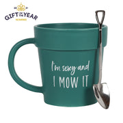 Lavish Kitchen Isle Sexy and I Mow It pot mug with matching shovel spoon, featuring humorous garden-themed design.