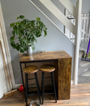 Industrial style bar table set by HOMCOM featuring a table with two stools and a storage shelf in a modern design.
