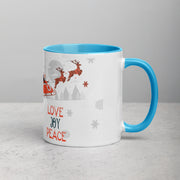 White ceramic mug with blue interior featuring Love, Joy and Peace design, by Lavish Kitchen Isle, 11oz size.