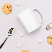 White glossy 15oz mug from Lavish Kitchen Isle with cookie design, perfect for coffee or tea.