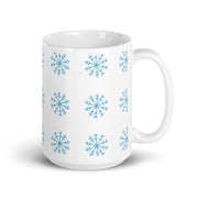 White glossy 15oz Christmas mug with snowflake design, handle on the right, perfect for holiday coffee or hot chocolate.